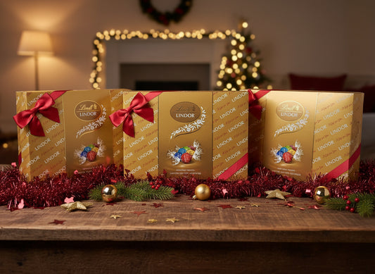 Lindor chocolate box with a red ribbon on a blurred background